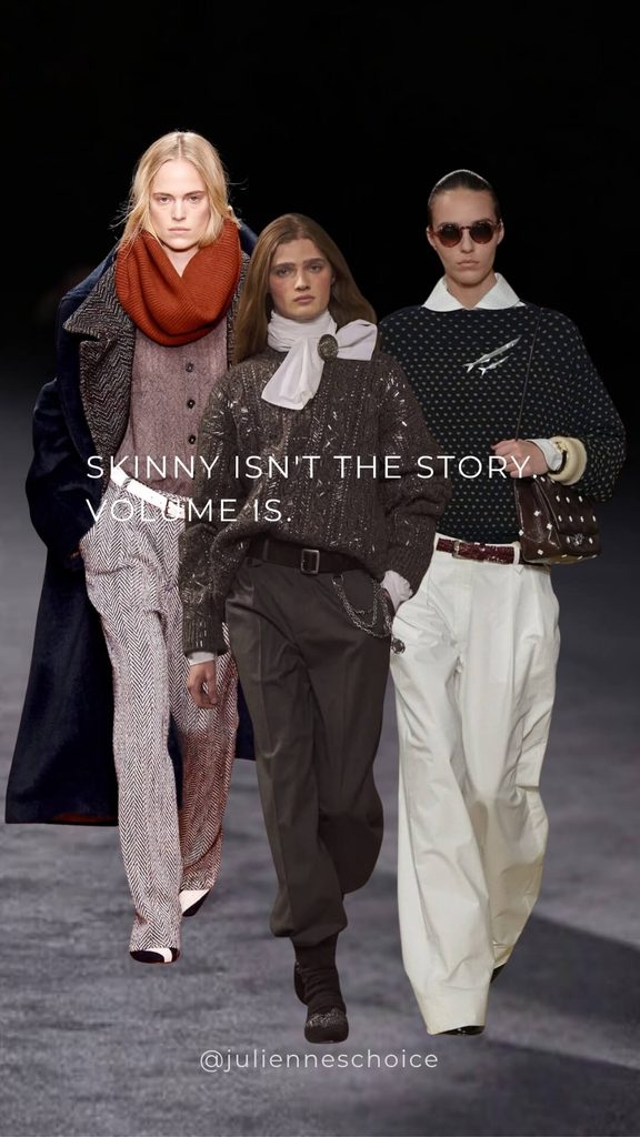 Pleated tailored trousers styled with knitwear and a leather belt